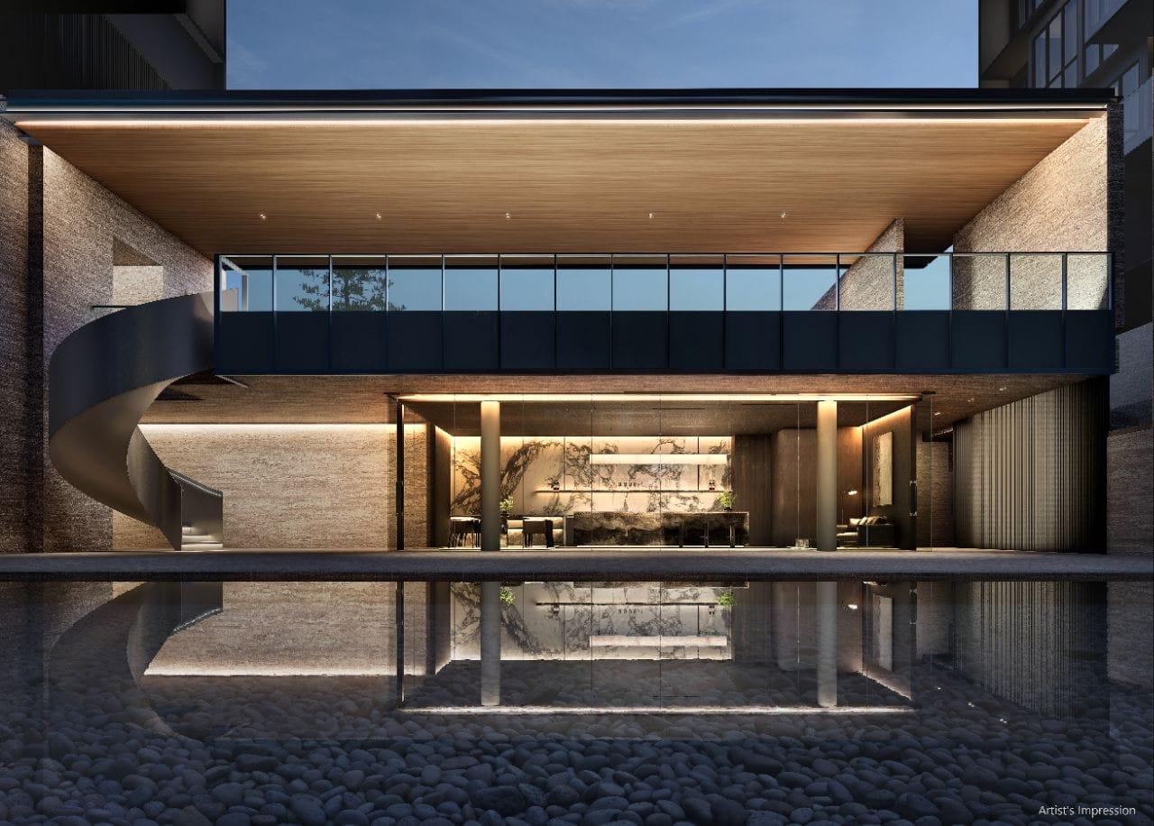 Function studio at Amberwood at Holland, a two-storey glazed clubhouse pavilion with a marble kitchen island reflected in a still water court