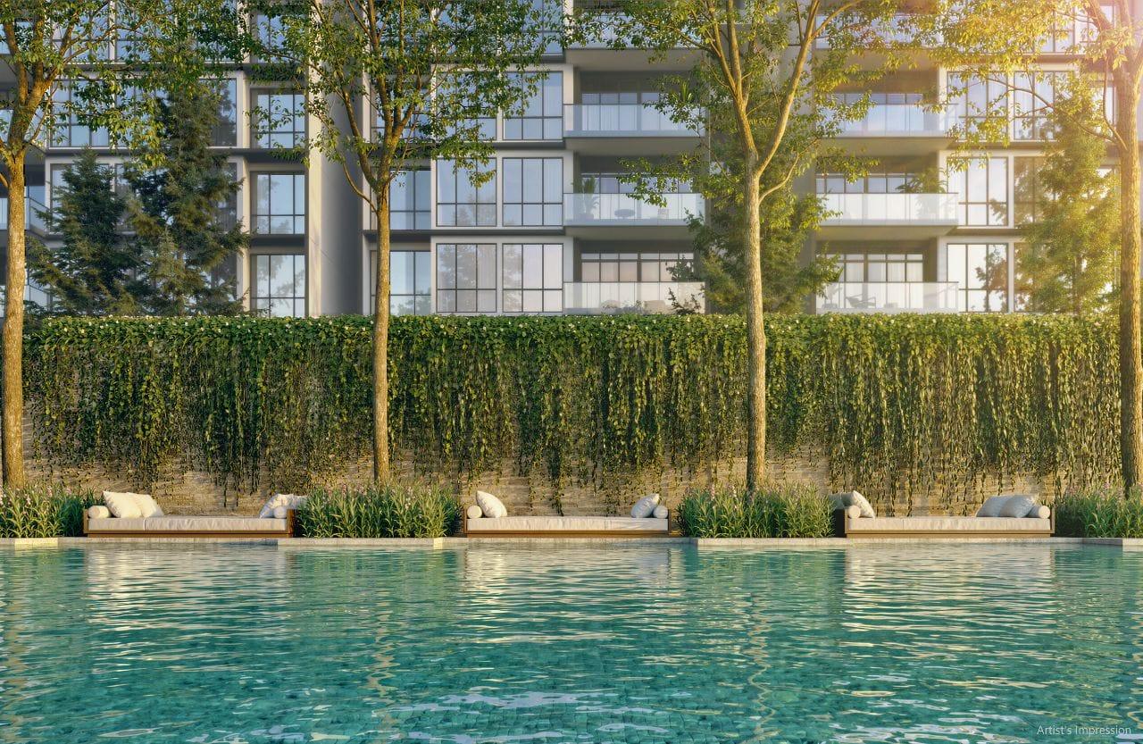 Poolside day lounges at Amberwood at Holland, daybeds set into planting along a green wall beneath the apartment balconies